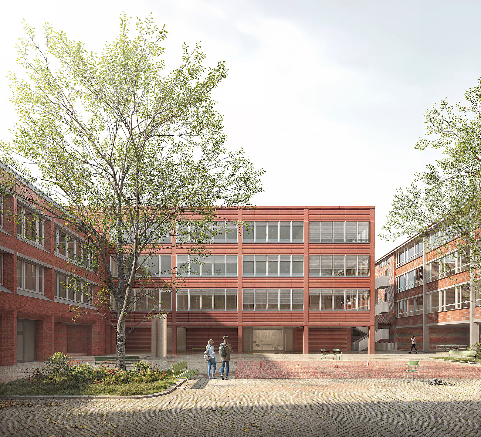 Das Bild zeigt den Schulhof mit dem Anbau vom Paulinum Gymnasium in Münster. 